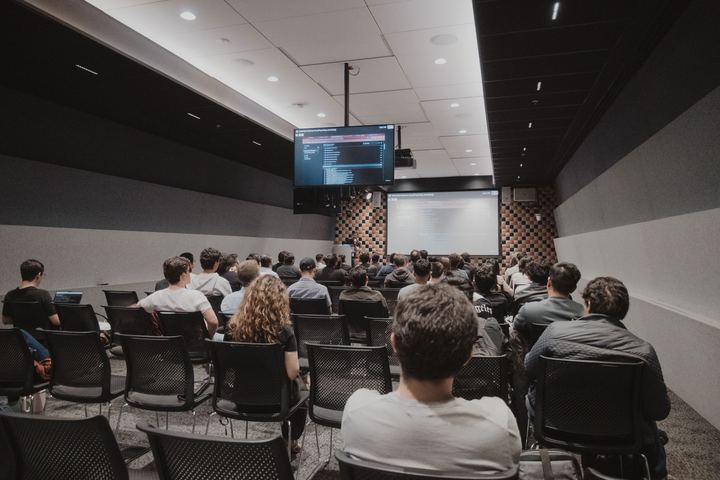 A full room seen from the back row.